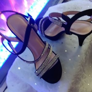 Black pumps with crystal like embellishments